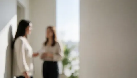 A blurred hallway in a medical clinic with soft natural light and neutral walls, suitable for psychology content