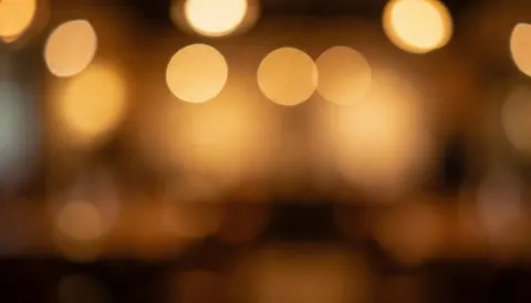 Soft warm blurred lights in a mexican bar creating a cozy atmosphere for text overlays and design projects
