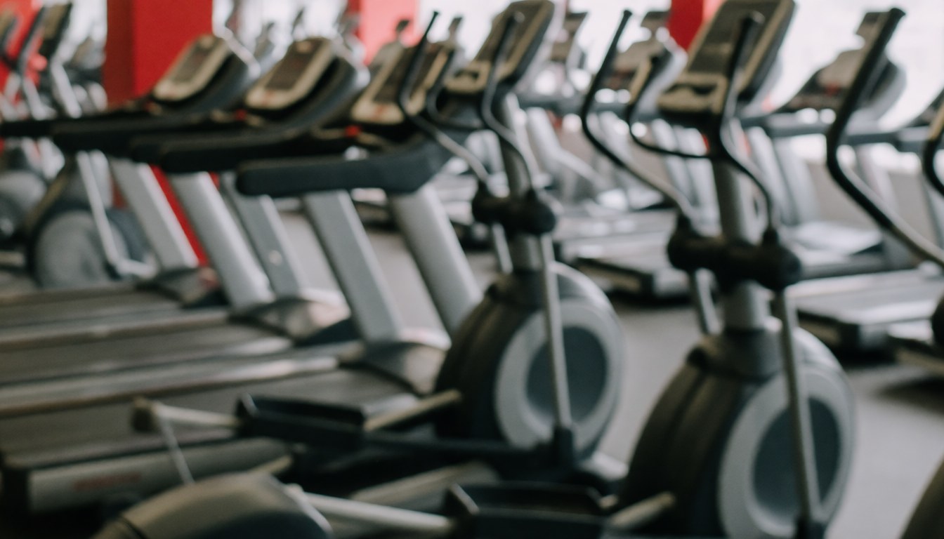 Blurred gym machines background with copy space for promotions and ads