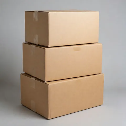 Three cardboard boxes stacked and taped on a neutral gray background, ideal for logistics and shipping