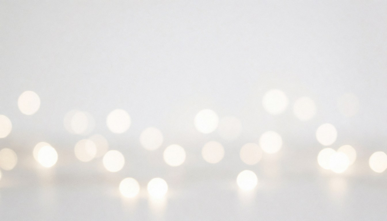 Minimalist white background with soft out-of-focus lights, ideal for placing text or logos in digital designs