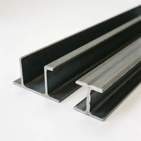 Two steel I-beams on a white background, showing their metallic structure and polished surface.