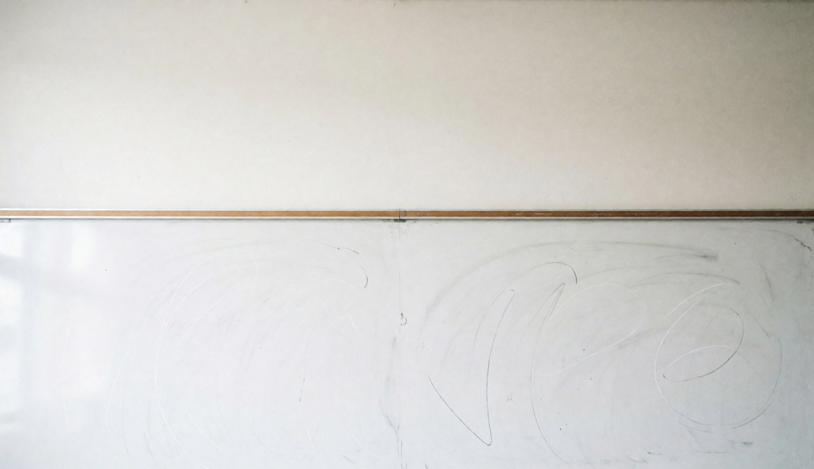 Clean whiteboard background with faint chalk marks, ideal for educational text overlays in university settings