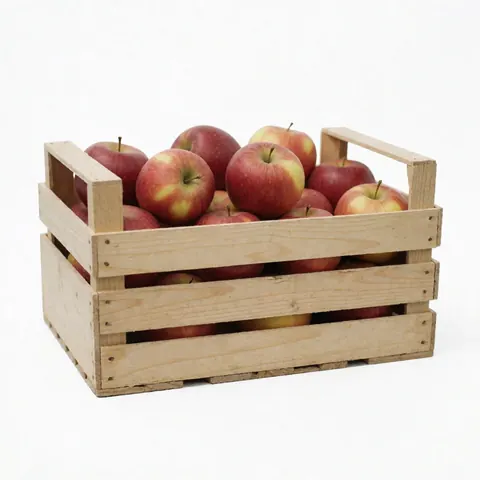 A wooden crate containing fresh red apples displayed against a clean white background for agricultural product use