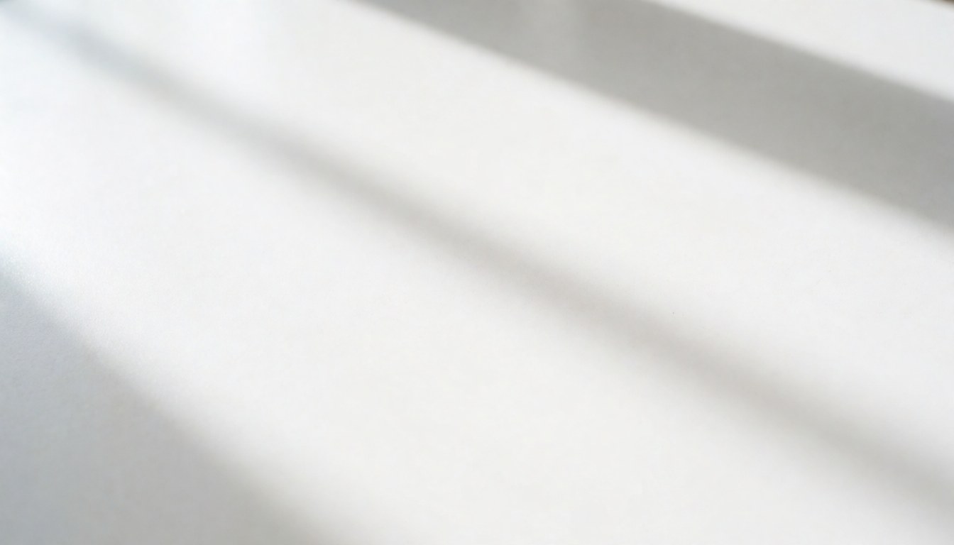 Clean white table surface with soft shadows, ideal for placing products or text for modern businesses