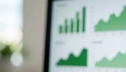 Blurred green and white financial charts background suitable for accounting and business text overlays, conveying a clean and professional atmosphere.