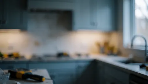 A clean modern kitchen background featuring hands working, suitable for text overlay in business contexts