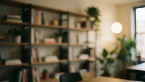 Modern office background featuring bookshelves filled with books, green plants, and warm lighting, ideal for corporate text and professional presentations.