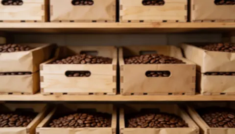 A textured background suitable for text overlay, featuring coffee beans and wooden elements related to coffee and cacao farms.