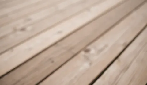 Close-up view of an abstract wooden texture with diagonal lines, serving as a warm and professional background for furniture store websites and interior design projects.