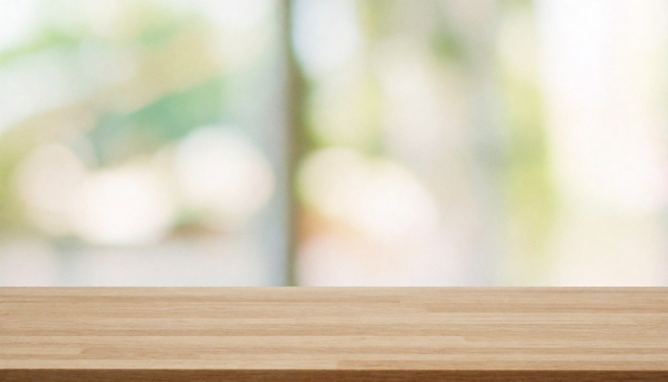 Light wood table with blurred background, ideal for presentations, training, or placing text and products in a professional minimalist scene.