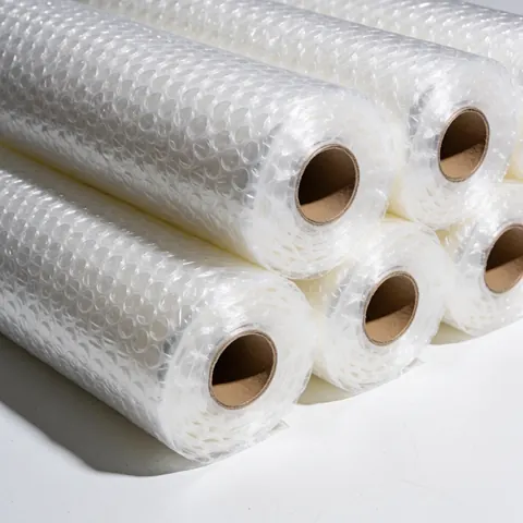 A close-up view of a roll of clear protective bubble wrap used for packaging and moving items safely during logistics and transportation