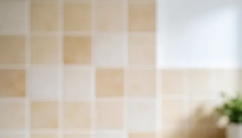 A softly blurred kitchen background featuring warm tones and clean tiles, providing ample space for text overlay in fast food business materials.