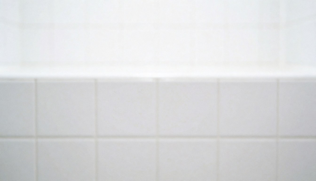 Clean white ceramic tile background suitable for text overlay, ideal for cleaning service marketing and hygiene-related business content