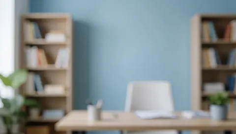 A clean blue background featuring a wooden desk, bookshelf, chair, books, and a plant, suitable for professional travel agency text overlays