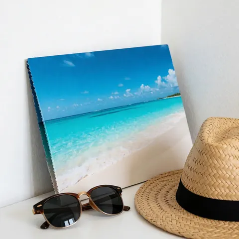 Travel brochure featuring a tropical beach scene with sunglasses and straw hat on a white surface, ideal for travel agencies