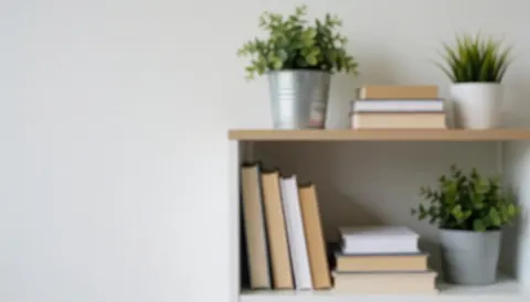 A clean office interior featuring wooden shelves filled with books and green plants, providing a calm and professional backdrop for text overlays related to nutrition and wellness.