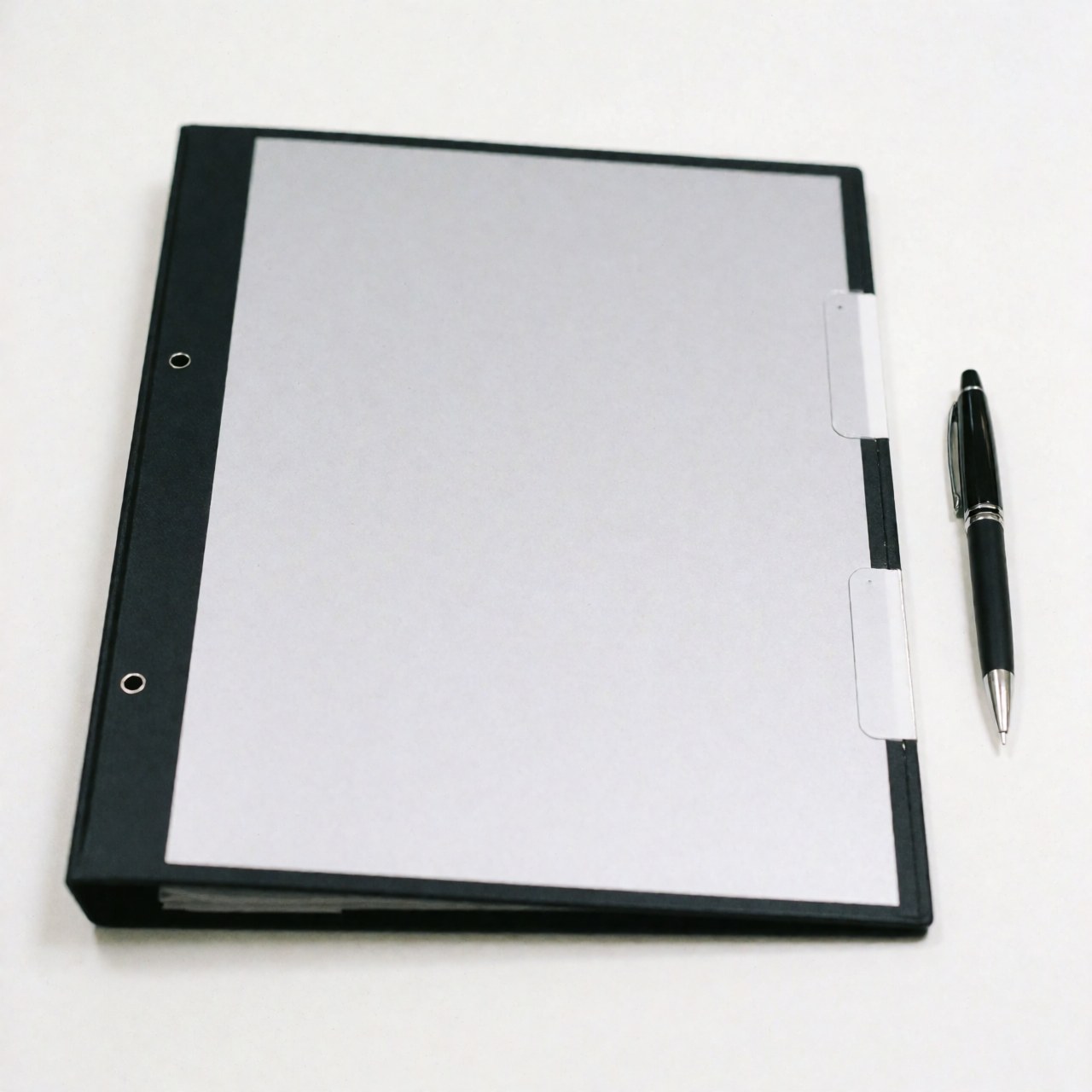 Professional sales folder with a black pen placed on a clean white surface, suitable for business presentations and agreements.