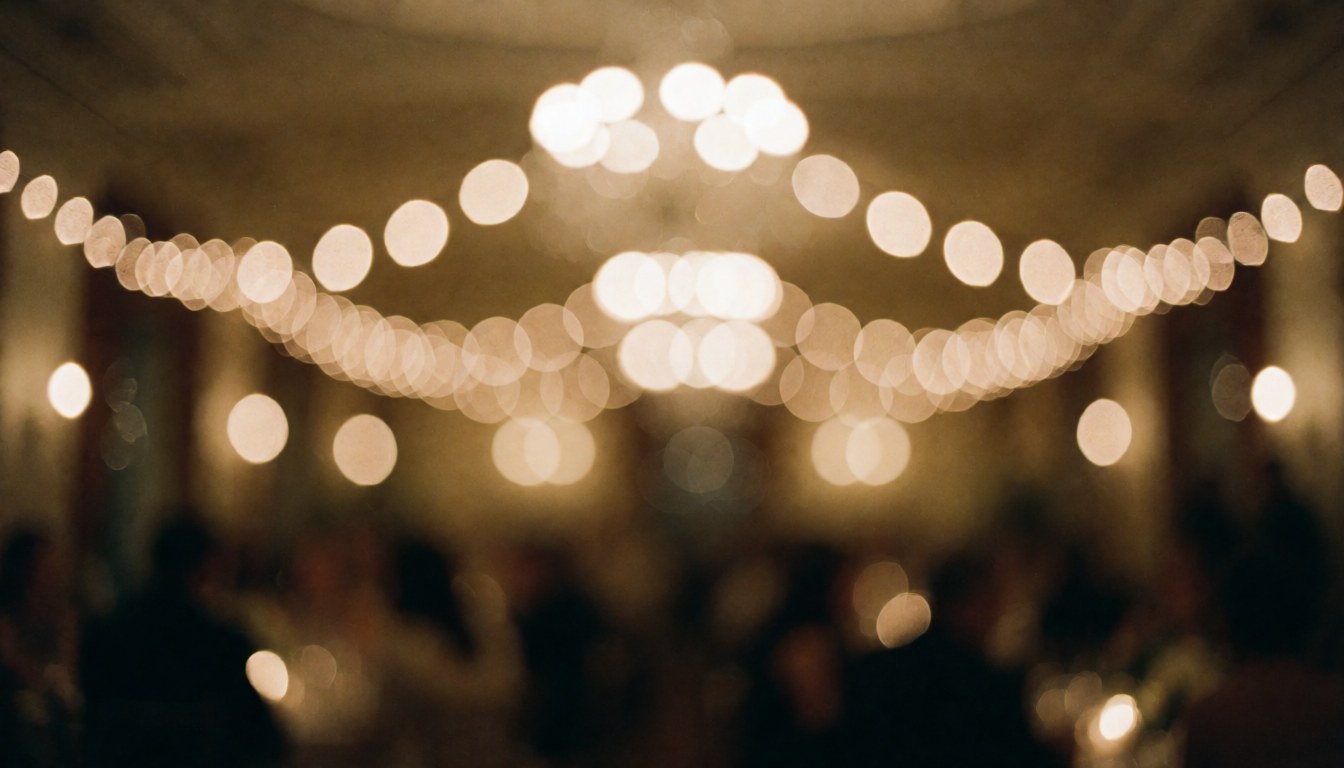 Soft romantic bokeh background with warm lights suitable for wedding invitations and event text overlays