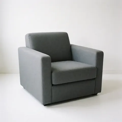 A modern gray upholstered armchair isolated on a plain white background, ideal for furniture store product listings and interior design catalogs.