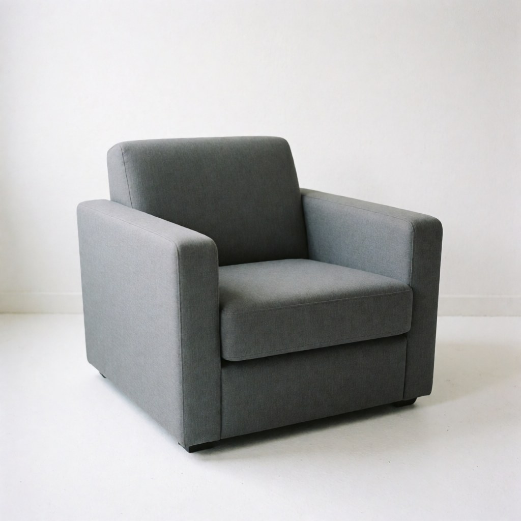 A modern gray upholstered armchair isolated on a plain white background, ideal for furniture store product listings and interior design catalogs.