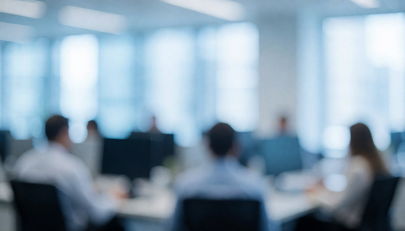 A soft focus background of a modern corporate office featuring a desk, chair, and window with natural light, ideal for business presentations.
