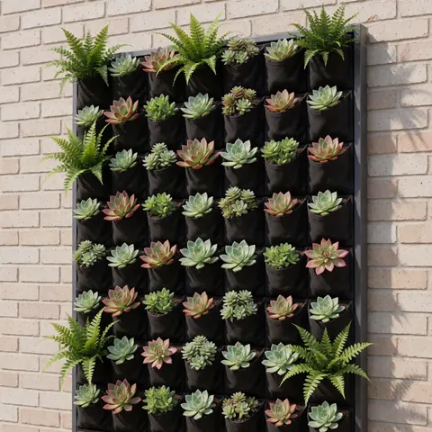 Vertical gardening panel featuring succulents and ferns in dark bags against a brick wall, showcasing a modern and tidy plant design for interior or exterior decoration.