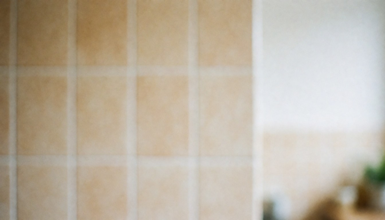A blurred kitchen background with warm tones, featuring clean tiles and a minimalist design, ideal for text overlay in fast food business contexts.