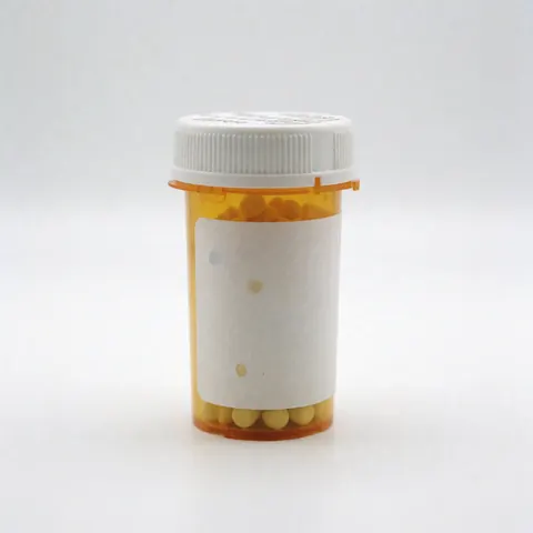A single medicine bottle placed on a plain white surface, representing pharmacy products and healthcare solutions for business use.