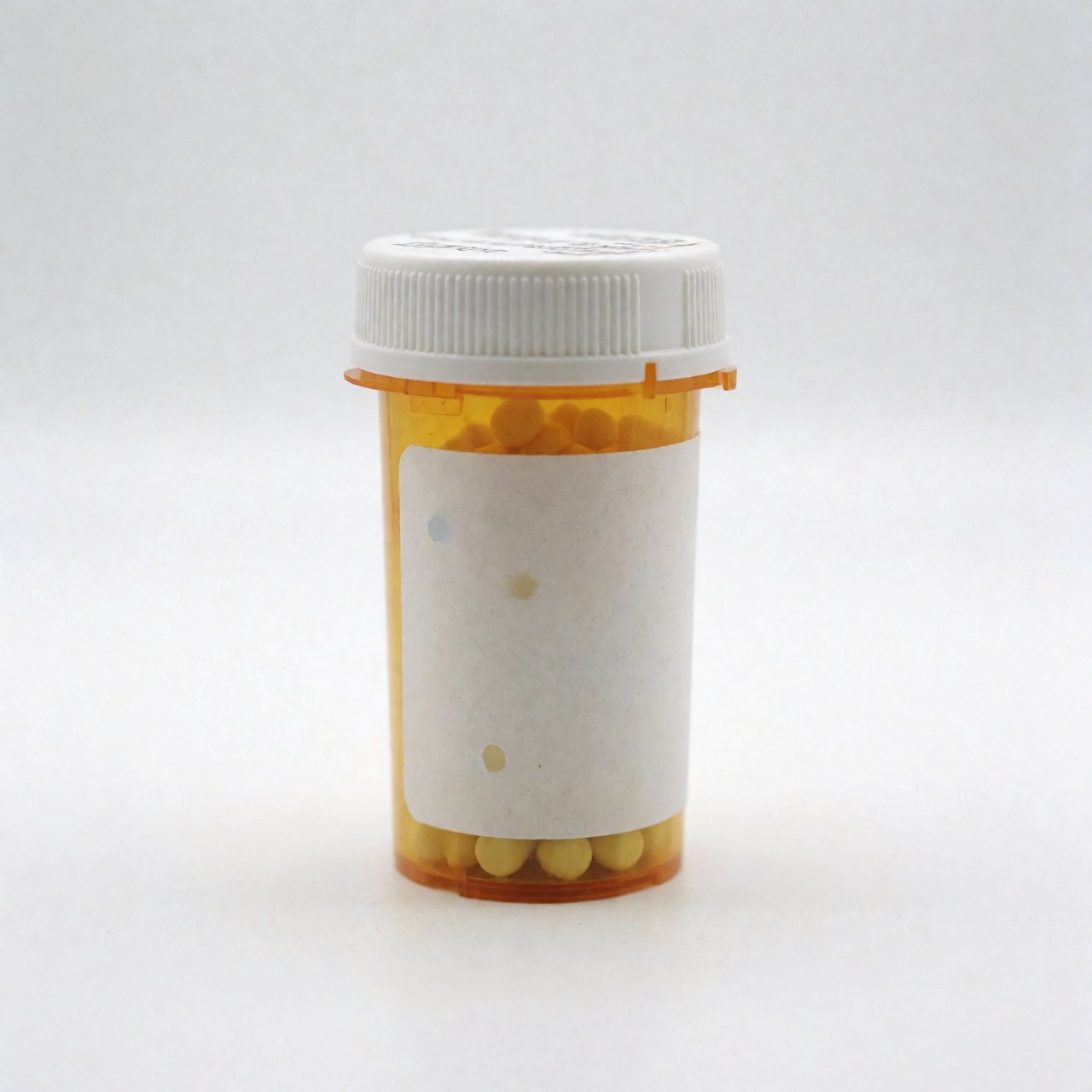 A single medicine bottle placed on a plain white surface, representing pharmacy products and healthcare solutions for business use.