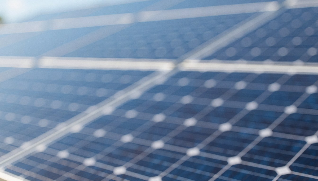 A soft, blurred background suitable for solar energy text overlays, featuring clean blue and green tones for professional web design and marketing materials.