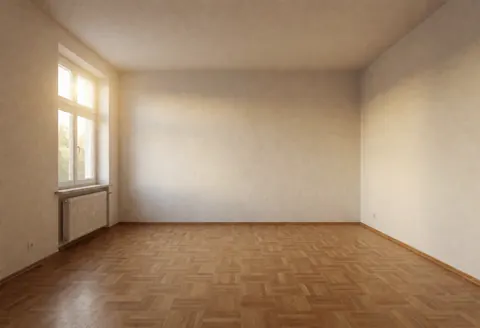 Spacious empty living room featuring clean parquet floors and smooth walls illuminated by soft natural daylight, ideal for moving or renovation projects.