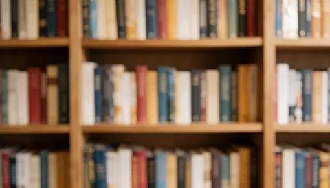 A soft focus view of a wooden bookshelf filled with colorful books, creating a calm and intellectual atmosphere suitable for bookstore text backgrounds.