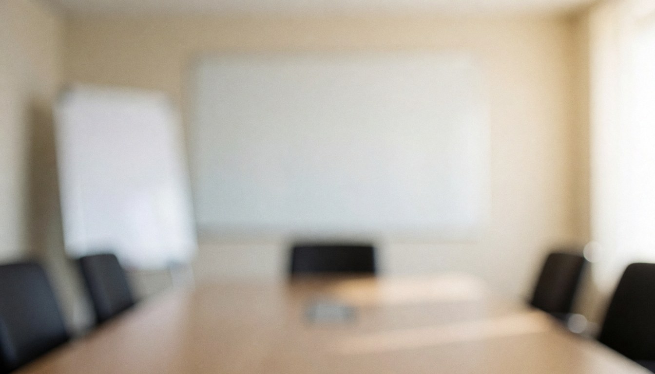 A clean and neutral corporate meeting room background featuring a conference table and whiteboard, ideal for business presentations and accounting text overlays