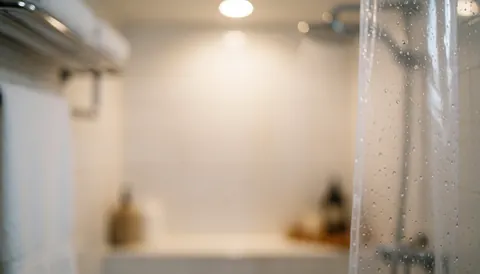 A soft, out-of-focus background featuring warm light and water droplets, evoking a relaxing spa and therapeutic massage atmosphere for wellness content.