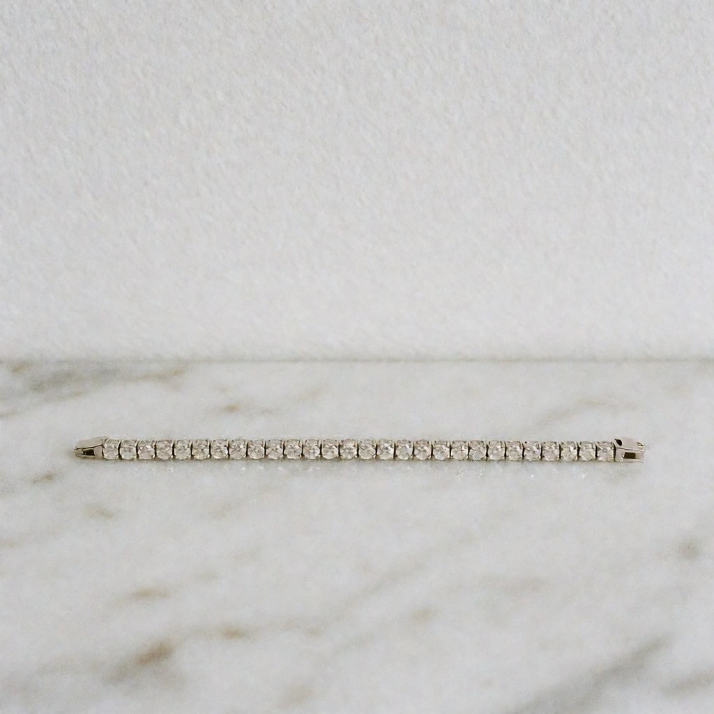 Shiny diamond earrings displayed on a white marble surface with professional lighting and symmetrical design for a jewelry catalog