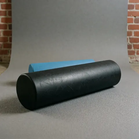 Detailed close-up view of the textured surface of a foam roller used for physical therapy and muscle recovery