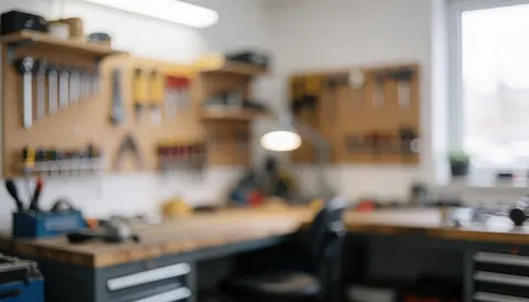 A clean workshop background featuring organized tools and ropes on a table with a professional bokeh effect