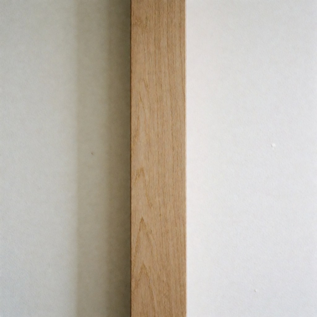 Close-up view of a repaired wooden furniture piece showing the final result with a clean, treated surface ready for use.