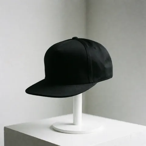 A modern black baseball cap displayed against a clean white background, showcasing a minimalist urban fashion accessory for clothing customization and branding purposes.