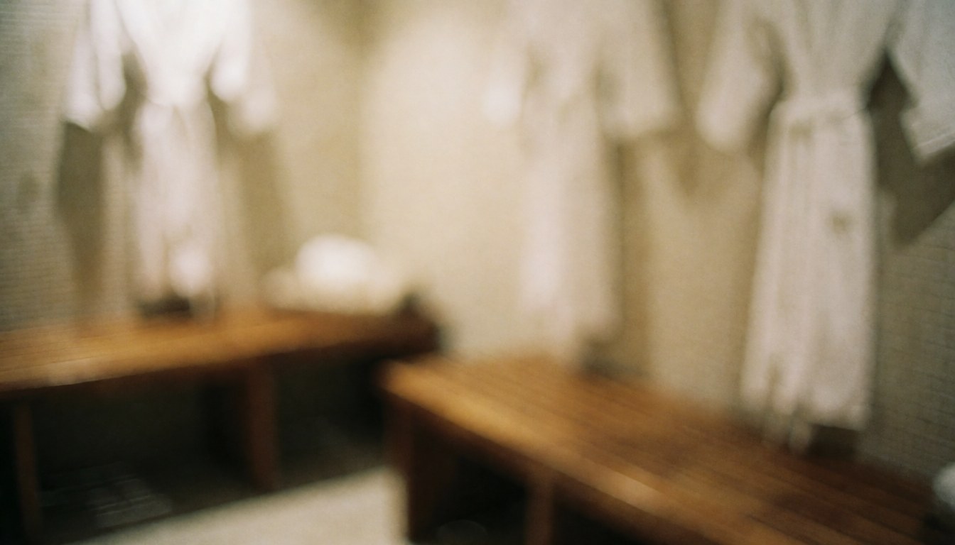 Spa locker room featuring wooden benches and white towels, warm lighting, and a relaxed atmosphere suitable for wellness text overlays.