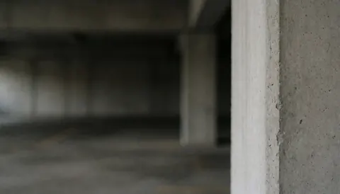 Professional gray concrete garage column background suitable for text overlay, photography services, and graphic design projects.