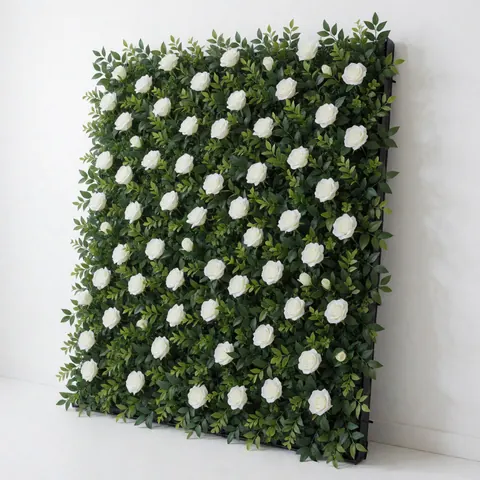 Modular decorative panel featuring white roses and green foliage, mounted on a white wall, angled view for event backgrounds and decor