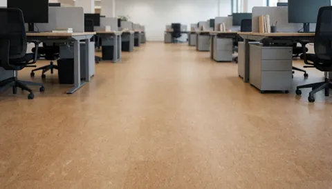 Beige cork floor in a modern office with ergonomic desks and chairs, creating a professional and acoustic environment for business use