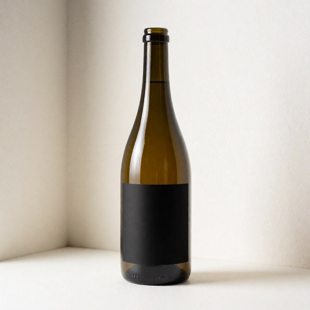 Glass jar with black label in white corner, softly lit, ideal for showcasing label design for textile printing services