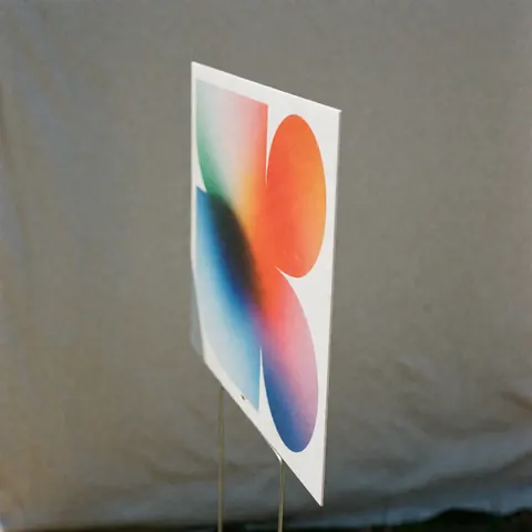Modern geometric textile printing sign featuring vibrant gradients on a neutral gray background, ideal for showcasing textile products.