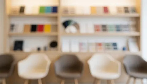 A waiting area featuring shelves displaying color samples, suitable for business text backgrounds