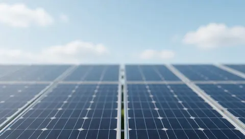 Professional solar field background with blue panels and clear cloudy sky, ideal for commercial text overlays.