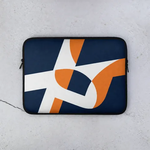 Top view of a blue laptop sleeve with white and orange abstract geometric design on light gray concrete surface with soft lighting