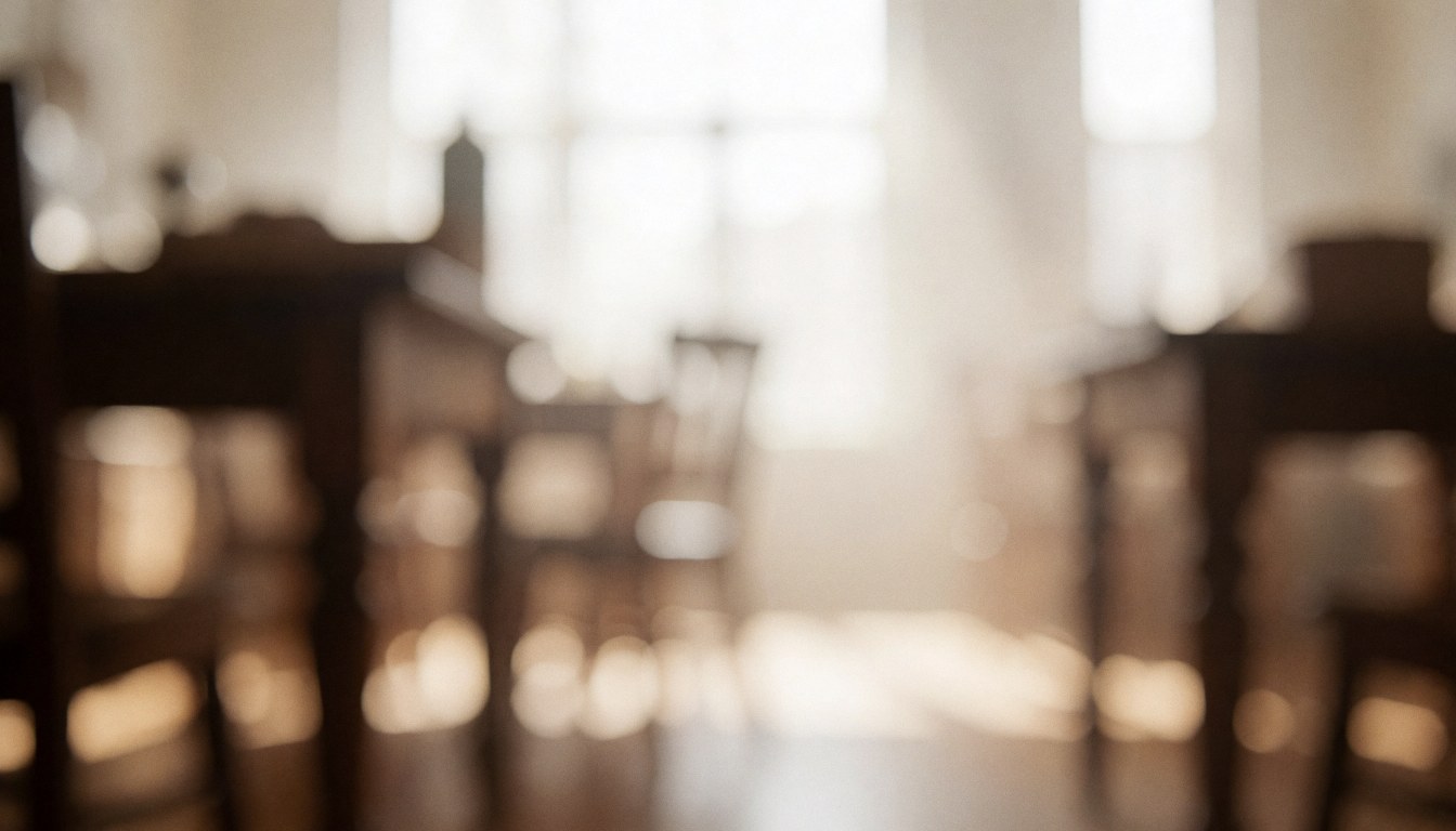 Soft blurred background of wooden furniture in a workshop with warm morning light, ideal for text overlay